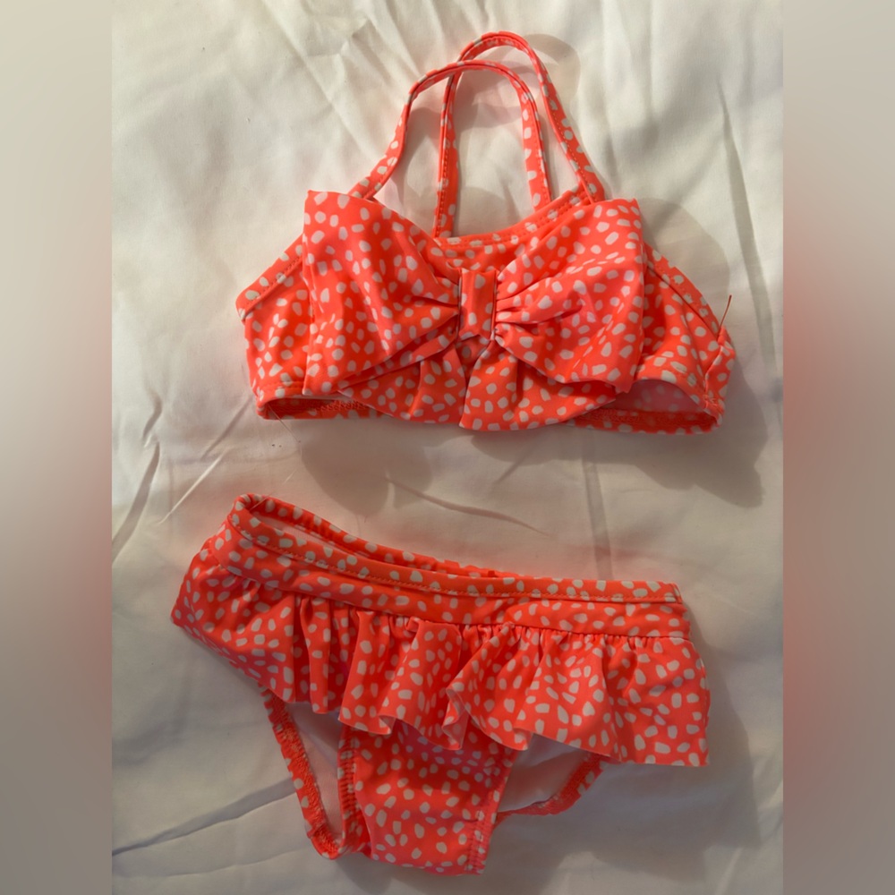 8 to 12 month two piece swimsuit new with the plastic tags..